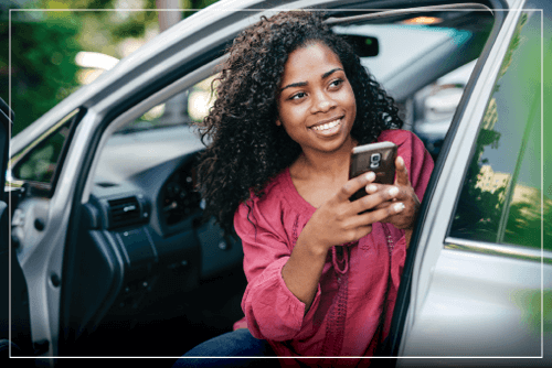 black women in card on phone